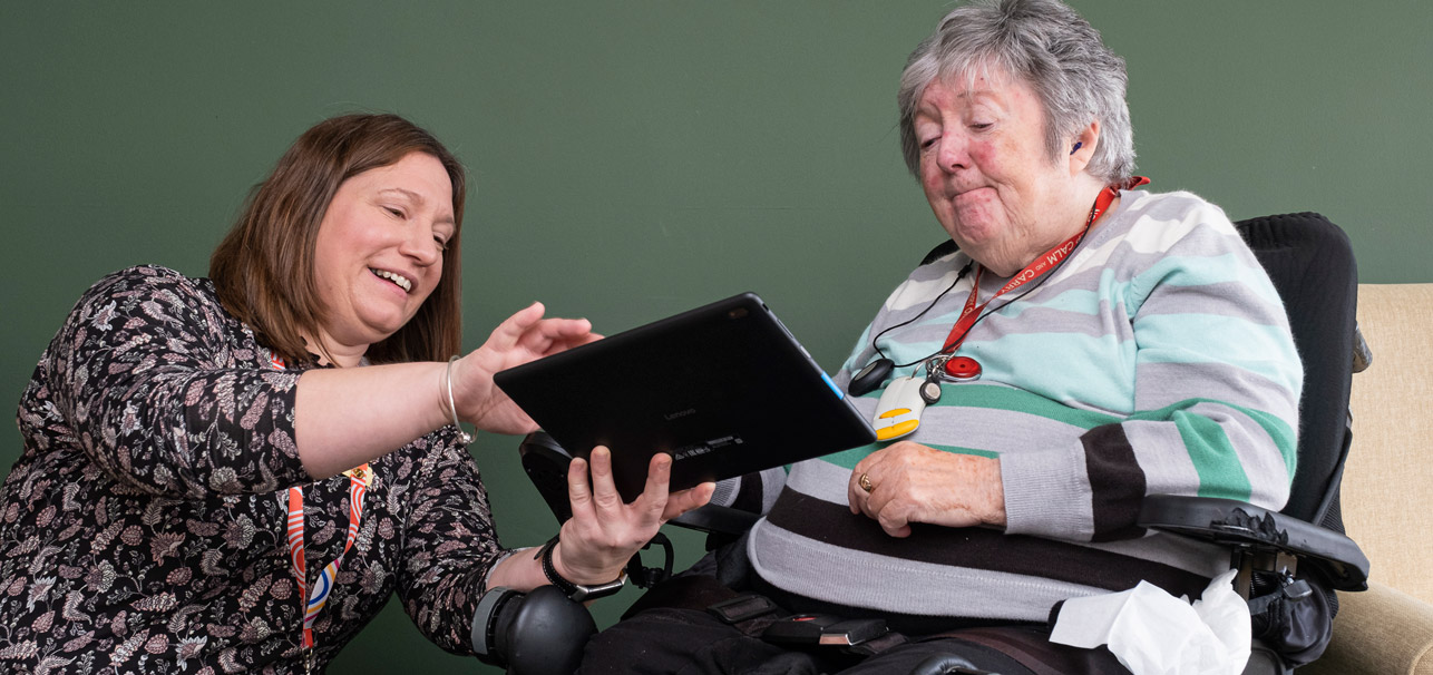 Lady demonstrating a tablet